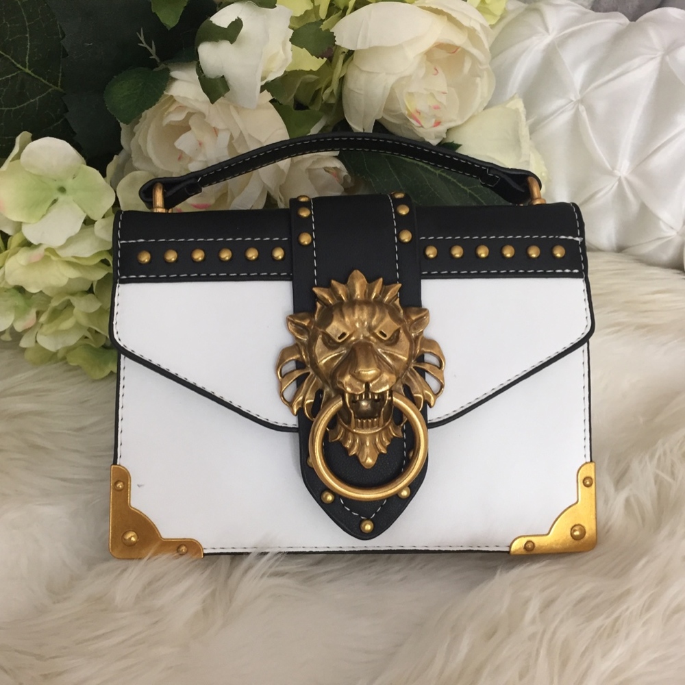 Elegant Black and White Crossbody Bag with Gold Accents